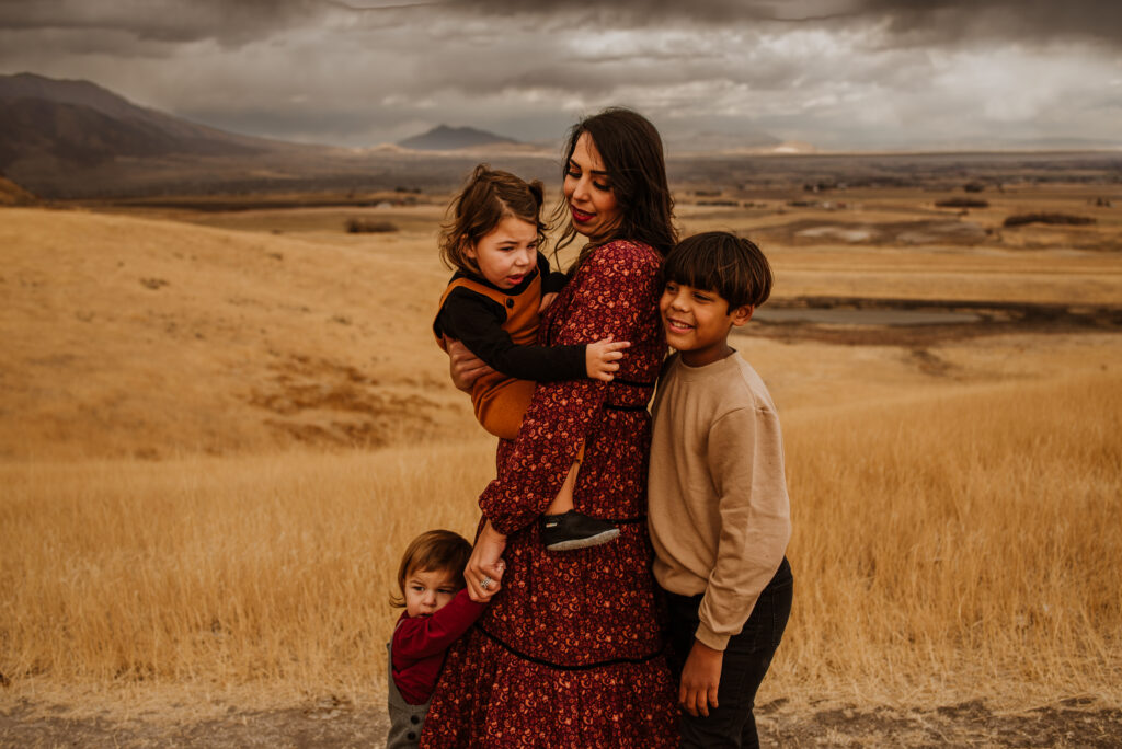 Stormy weather Logan, Utah family photoshoot dressed in earth tones