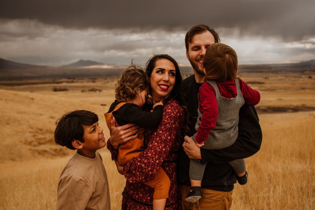 Stormy weather Logan, Utah family photoshoot dressed in earth tones
