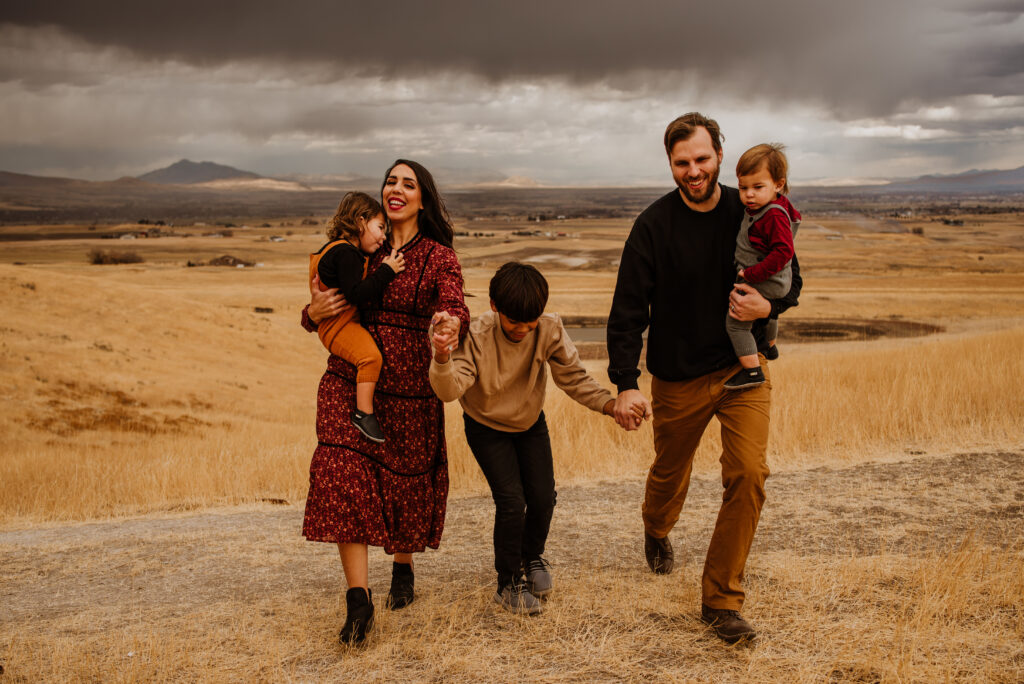 Stormy weather Logan, Utah family photoshoot in yellow field